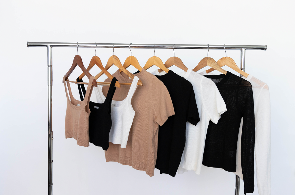 INTACT capsule collection hanging on clothes rack