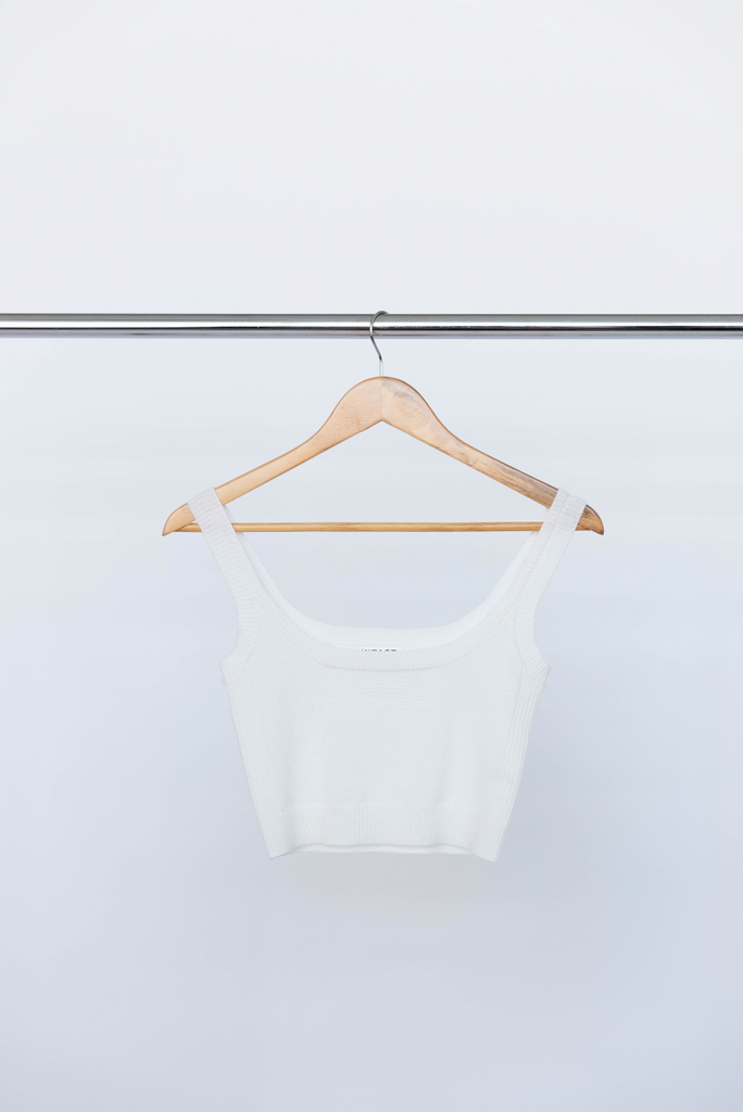 INTACT white knit singlet on clothes hanger