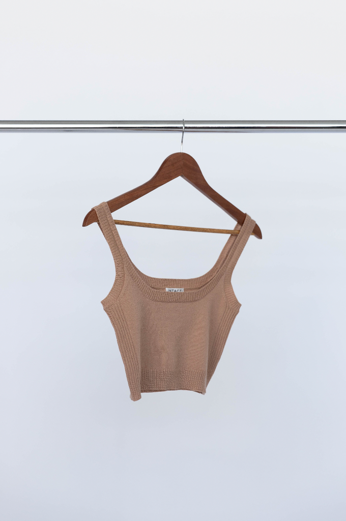 INTACT latte coloured merino wool singlet on clothes hanger